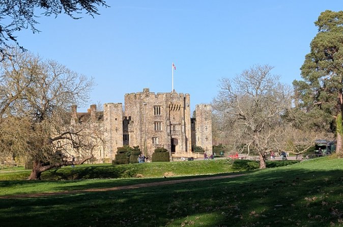 Hever Castle in winter, with bare trees along the walk up to the gatehouse