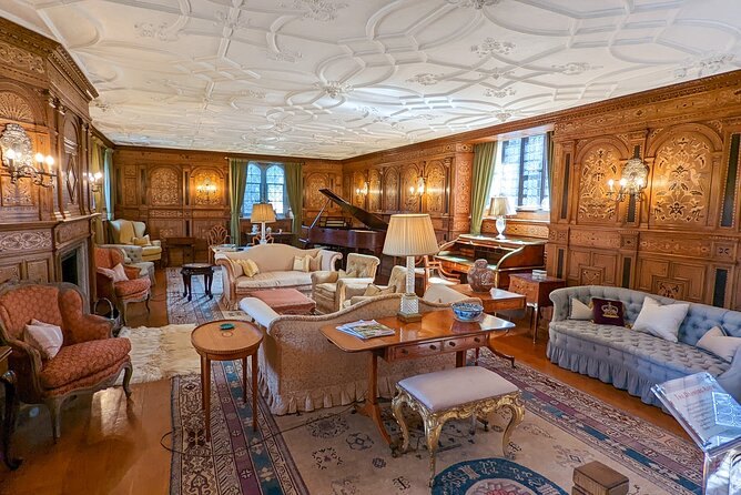 The panelled Drawing Room at Hever Castle, with its plaster ceiling and long carpet
